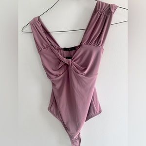 Saints Purple Soft Bodysuit. Size S